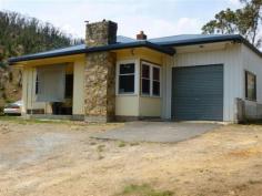 18 Torrens Valley Rd Chain of Ponds SA 5231 $360,000-$380,000 RENOVATE OR REBUILD - 2.5 ACRES Property ID: 9004716 Great location with no neighbours and only a couple of minutes to the local township. The property features a timber framed home with 2 bedrooms, separate living, and open plan kitchen/dining. Good shedding. Special features: River Torrens frontage and views. 2 bedrooms, however, currently used as single bedroom and extra living room. Renovated kitchen with electric range and also wood stove. Living with s.c. heater. Single enclosed carport, plus 30′ × 20′ workshop with power and light. Undulating gum studded 2.5 acres gives a dress circle view of the Bay to Birdwood run. Don’t miss the rare opportunity in securing a hard to find small easy-care parcel of land only minutes to Tea Tree Gully. Redevelop the home or start again. $380,000 Land Area 2.5 acres