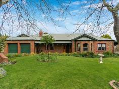 3 Bon Street Lobethal SA 5241 $479,000-$495,000 Smitten By Style... Property ID: 10492714 Living is easy in this impressive, generously proportioned contemporary residence with a beautiful outlook over the landscaped gardens, and charming creek setting. A wonderful offering, master built nestled on a large 1455sqm level block in a desirably tranquil cul-de-sac location. Solid, stylish and with high ceilings the builder has created timeless appeal which will reflect the personality and taste of those accustomed to the best in quality design, finishes and lifestyle. The Federation style brick home encompasses four spacious bedrooms with plenty of room for study, sleep and storage, two luxurious bathrooms, and a well appointed, open plan kitchen and living area that flows through to the private rear patio. The spacious master bedroom, complete with walk-in robe and ensuite, ensures parents have a private space at the western end of the home. The entrance hallway immediately reveals a theme of quality, with federation style floor tiling, ornate cornicing and ornate ceiling rose. The hallway also offers a quality timber front door with inlaid leadlight windows. The formal lounge room offers carpet and feature glass double access doors. There is also an inbuilt gas log fire place with gorgeous decorative porcelain tile component. An ornate timber fire surround also highlights this quality fixture. Elaborate cornicing is also present in the formal lounge room and is further enhanced by the high ceilings throughout the home. The open plan family living area looks out over the beautiful garden and grounds. The kitchen offers ample cupboard and bench space, corner pantry and there is a brand new self cleaning electric oven. Looking out onto the living area , the room is light and bright via the use of glass sliding doors and the outside entertaining area has been covered with suntuff roofing to further enhance and promote good light flow. The established garden, presents an open grassed area with a mix of European tree’s including Gladitsia, Camelia’s, Liquid Amber, Manchurian Pear, Weeping Wisteria, bulbs and many more shrubs and flowering plants. There is a beautiful creek setting also flowing through the southern end of the property, complete with charming footbridge over the creek. There is a double car garage with fixed cupboards and pull down stair access to the upstairs, fully lined loft area with light and power, which could lend itself to a become a teenage retreat. Perfect for a family, this home is ideally positioned and retains the value of peaceful living while being conveniently close to shops, school and transport. Land Area 1,455.0 sqm