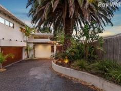 2/498 Main Street Mordialloc VIC 3195 A Tropical Oasis of Brilliant Easy Care Living Sophisticated, stylish and perfectly positioned for a wonderful bayside lifestyle, this flawlessly finished three bedroom residence offers exceptional low-maintenance luxury while delivering on all aspects of contemporary family life. The progressive combination of luxurious internal design cushioned with stunning tropical landscaped gardens highlight the considered sense of space, and ensure that the interior and the beauty of the landscape are always connected. An expansive open-plan living / dining / kitchen domain forms the hub of this sun-drenched sensation, where the ground level is all about entertaining with a gourmet kitchen enjoying stone benchtops and stainless steel European appliances plus walk in pantry, and the generous living / dining space opens seamlessly through glass doors to a stunning outdoor oasis, creating a harmonious sense of balance. The north and west wrap around terrace is all about outdoor living and entertaining; with exquisite wood-fired pizza oven, outdoor spa, and private tranquil alfresco surroundings - the outdoors have never looked this good, while also delivering a backdrop of greenery and natural light to the interior. Accommodation is zoned with all bedrooms on the upper level. The stunning master suite enjoys generous walk in robe, sumptuous ensuite, and exquisite private balcony - just the place for quiet contemplation; while the second and third bedrooms, both featuring built in robes, share a delightful intimate balcony. The upper level is complete with generous study nook, and sparkling central bathroom, and separate WC. Comprehensive appointments include sleek powder room, separate laundry, gleaming timber floors on the lower level, carpet upstairs, split system air conditioners throughout, gas log fire in the living room, alarm and remote double garage with secure internal entry. Private and secure, this exceptional family residence is just minutes from the beach, parks, local schools, and the shops, cafes, restaurants and transport of Mordialloc Village.