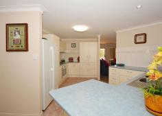 7 Stevens Cl Kawungan QLD 4655 $439,000 DOUBLE BAY SHED & COVER FOR THE VAN This home is neat as a pin and in an excellent location - not a busy road; a quiet cul de sac and yet close to Aldi & Stocklands. On the high side of the street, catching the breezes, this 4 bedroom home, with ensuite & WIR to the main bedroom and built ins to the other bedrooms, would make an ideal home for either retirees with their van or a tradie family who have toys and need a workshop area. The home has a huge outdoor entertaining area, air conditioning to the main bedroom, 4 KW solar power, security screens, internal access from the double lock up garage, paved green house area and a garden shed. The kitchen incorporates a breakfast bar, plenty of drawers and plumbing for the icemaker fridge. The dining/family room opens to the outdoor entertaining area - great for catering. With a separate lounge room, and the second living area, this ensures that everyone can watch the TV channel of their choice. There are ceiling fans and vertical drapes throughout the home with the second bathroom a good size and a separate toilet. Storage in the laundry and access to the paved area outside just contribute to a very neat, liveable home. Privacy and plenty of shade for the entertaining area is achieved with retractable blinds and decorative panels. The shed is 9m x 7m with 2 roller doors and a 2.9m opening while the carport fits a 21 foot caravan and boat. You need to see the inside of this home, so ring for an appointment. Property Features Land Size : 740 m2