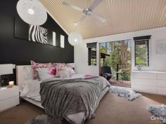 9 Native Bird Pl Buderim QLD 4556 $889,000 Bali At Home, Tranquil Resort Style Living Revitalise your inner spirit and peace in this resort style home located on the acreage foothills of Buderim. Sprawling over natural rainforest behind remote gates, this stunning pavilion style residence is interlocked by a defined entrance, encapsulated by running water features that leads into the outdoor living room deck. From here, you can relax and enjoy the sounds of nature, overlooking your own private pool and rainforest. A charming Pot Belly Stove ensures warm comfort for those cooler months. This home has dual accommodation to cater for a growing family. Features include: a raised spa with running water features through to a lagoon pool. This hidden sanctuary offers more than you could imagine and is sure to impress those who wish to holiday at home. To the main residence there is an air-conditioned spacious open plan kitchen living/dining area, with feature high ceilings. There are ample windows and timber stacker doors that allow plenty of natural light into the home. This area is fully tiled and has a modern kitchen, with excellent appliances and island bench. Adjacent is a hallway which leads to the king size master bedroom. It has a large walk-in wardrobe and adjacent bathroom, with a bath, shower, powder room area and separate toilet. There is also a second queen size bedroom that has built-in wardrobes and ceiling fan. Your separate guest accommodation incorporates a spacious open plan living area, with beautiful timber flooring and tiling, soaring high ceilings and a timber staircase that leads up to a bedroom loft. The centre piece of the room is an ornate open feature fire place, where you can spend winter nights relaxing. Adjacent is a well equipped kitchen area with sink, ample cupboard and bench top space, plus dishwasher. There is a separate shower room with toilet, single vanity and shower. To the outdoors off the living area you have your own private balcony that has timber flooring. Here you can sit and enjoy the tranquil rainforest views. Leading off from the main living area is a stunning master bedroom which has a huge separate walk-in wardrobe. It has its own private en-suite with a double shower, plus single vanity and toilet. The master bedroom has its own private timber deck, which leads out to the swimming pool. To the outdoors in the main entrance area, is the enormous Balinese style undercover outdoor living deck, which is large enough to host the largest of occasions and family gatherings, in your own private surroundings. This truly unique home has far too many features to list. Only an inspection will do it justice. - Four Bedrooms, Plus Study, Plus Loft, Plus Craft Room - Gated Approx 2,002m² Acreage Allotment, In Cul-de-sac Location - Approx 421m² Home Main Residence Features: - King Size Master Bedroom With Spacious Walk-In Robe & Ceiling Fan - Queen-Size Bedroom With Built-In Wardrobe & Ceiling Fan - Bathroom, Single Vanity, Bath, Shower & Separate Toilet - Air-Conditioned Spacious Tiled Kitchen Dining/Living - Soaring High Ceilings - Kitchen With 900m Free Standing Oven & Range Hood - Ample Cupboard & Bench Top Space, Plus Bosch Dishwasher - Large Separate Multi-purpose Room Underneath Main Residence Guest House Features: - Master Bedroom With Private Balcony & Timber Decks - Large En-Suite With Shower, Single Vanity & Toilet - Spacious Separate Walk-In Wardrobe - Spacious Open Plan Living Area & Feature Fire Place - Kitchen, Ample Cupboard & Bench Top Space, Sink & Dishwasher - Polished Timber Floors & Tiling, Timber Staircase To Bedroom Loft - Separate Shower Room, Single Vanity, Shower & Toilet - Large Separate Walk-in Storage Room With Shelving Outdoor Features: - Stunning Water Feature To Main Entrance - Undercover Balinese Outdoor Living Area Overlooking Pool Area - Surrounded By Stunning Private Rainforest Back Drop - Extensive Outdoor Timber Decking & Timber Doors - Lagoon Style Pool With Spa & Cascading Waterfall Feature - Large Undercover Area For Caravan/Boat Or Work/Shop - Spectacular Rainforest Views From All Rooms - Private Lush Gardens With Lots Of Birdlife & Fauna - Larger Than Average Separate Double Remote Garage This is a rare opportunity to purchase an executive dual accommodation residence. Only an inspection can do this property justice. PROPERTY DETAILS $889,000 ID: 385224 Land Area: 2002 m² Building Area: 421