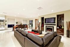 43 Cathedral Rise, Doreen VIC 3754 Lavish entertaining & low maintenance living Sale by Negotiation Purpose built for lavish entertaining and low maintenance living, this stunning residence - the builder's own - offers grand proportions, luxurious finishes and an outstanding alfresco entertaining area that is sure to impress. Set on a 1236m2 (approx.) landscaped allotment, the formal lounge is complemented by a spacious family living and dining area with gas log fire. The stone finished entertainer's kitchen offers a full suite of quality European appliances, including integrated coffee machine and butler's pantry. Integrated storage solutions are abundant in the expansive rumpus that opens to a superb private alfresco area with outdoor kitchen and an uninterrupted view across grazing land. The master suite features a fitted dressing room and stone ensuite including dual vanities, spa and double frameless shower, while an additional three bedrooms share a well-appointed family bathroom. The lower level introduces an 82m2 (approx.) multipurpose room with an independent entry. The large space is fitted with a kitchenette and powder room, making it perfect for a kids retreat, home office or both. A long list of extra features include a fitted study, porcelain tiles, timber floors, imported designer fittings, ducted heating and cooling, workshop and sprinkler system - everything you need for a wonderful, low maintenance lifestyle.