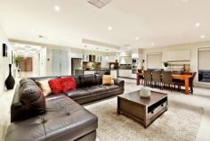 43 Cathedral Rise, Doreen VIC 3754 Lavish entertaining & low maintenance living Sale by Negotiation Purpose built for lavish entertaining and low maintenance living, this stunning residence - the builder's own - offers grand proportions, luxurious finishes and an outstanding alfresco entertaining area that is sure to impress. Set on a 1236m2 (approx.) landscaped allotment, the formal lounge is complemented by a spacious family living and dining area with gas log fire. The stone finished entertainer's kitchen offers a full suite of quality European appliances, including integrated coffee machine and butler's pantry. Integrated storage solutions are abundant in the expansive rumpus that opens to a superb private alfresco area with outdoor kitchen and an uninterrupted view across grazing land. The master suite features a fitted dressing room and stone ensuite including dual vanities, spa and double frameless shower, while an additional three bedrooms share a well-appointed family bathroom. The lower level introduces an 82m2 (approx.) multipurpose room with an independent entry. The large space is fitted with a kitchenette and powder room, making it perfect for a kids retreat, home office or both. A long list of extra features include a fitted study, porcelain tiles, timber floors, imported designer fittings, ducted heating and cooling, workshop and sprinkler system - everything you need for a wonderful, low maintenance lifestyle.