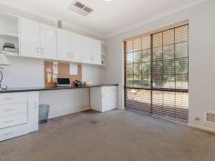 19 Kurrajong Rd Safety Bay WA 6169 $300,000's CHARMING HOME AND A HUGE BACKYARD! Positioned on a large 704sqm block in Safety Bay, this property would be perfect for anyone wanting a huge back yard that is ready for a pool or workshop, or for someone who is just looking for a wide open space to enjoy with the family. The property offers a good size lounge which enjoys a front yard outlook and flows through to the separate dining area which has been cleverly redesigned into a study nook with built in desk and shelving. The spacious living area occupying the centre of the home is overlooked by the open plan kitchen that offers additional access through to the front of the home. Complete with good bench space, gas stove and rangehood, the kitchen enjoys views out to the patio and is ideally located for entertaining visiting guests. Each of the bedrooms are located to the rear of the property and are serviced by the updated bathroom that has been modernised with glass screen shower and chic vanity. Outside, the patio provides a great entertaining space that overlooks the rear yard which is complete with raised garden beds, two sheds and a huge lawn which is ideal for adding a swimming pool or workshop. Located at the rear of the single garage is a good size brick workshop or storeroom, perfect for a man cave or just storing additional belongings from your new home. Other features include: - Ducted reverse cycle A/C - Potential drive through side access - Automatic bore reticulation With everything that the Safety Bay area offers, you'll have the benefit of schools, parks, beaches and shopping all just a few minutes away - you could not ask for a better location or property! Contact David Parlor on 0412 734 727 for a private viewing.
