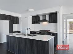 9 Honeysuckle Court Jimboomba QLD 4280 $433,000 Stylish Home, Prime Position A rare opportunity to enjoy an elevated position at the top of this small and select cul de sac of just 10 homes, within walking distance of the local parks and schools, in this attractive and very progressive location. A home of distinction awaits your inspection, from that stylish rendered / rock façade on through the practical no nonsense floor plan and out to the back yard beyond, on this fully serviced 900 sqm block, I think you’ll find a bright and comfortable home, with a range of attractive features. The carpeted formal lounge or media room, enjoys views to the front of the property, and offers a room that’s perfectly proportioned with the added benefit of those stylish yet practical window shutters. The fully tiled family and dining room again offers a balance between style and functionality, with stacker patio doors (and security screens) gliding back to give uninterrupted access to the al fresco dining area, which has been incorporated under the main house roof, while the reverse cycle air conditioner will ensure your comfort throughout the year. A substantial 5 burner gas cooking range, with electric oven awaits your inspection, complimented perfectly with abundant caesarstone bench tops with extensive high and low line cupboards, offering plenty of storage space in this attractive kitchen area. Caesarstone extends to both bathrooms, with a twin vanity unit and oversize shower featuring in the en-suite (with separate toilet closet) of this very spacious master bedroom, which also boasts an equally spacious walk-in robe. Double built-ins, then should come as no surprise in each of the other three bedrooms. Cupboard space too is good news, with double linen in the hall plus a separate broom cupboard and then another linen cupboard in the laundry as well. And as you will have seen in our images, there is the obligatory double lockup with internal access, in this case with a timber style door in keeping with timber front door which contracts exceptionally well with the rendered façade. The kid and pet friendly back yard is fully fenced, with plenty of level yard for everyone to enjoy, which has been thoughtfully separated from the garden area by that substantial sandstone retaining wall. So if you have been looking for a suitably stylish yet practical place to call home, enjoying a prime and elevated position here in a quiet cul de sac, within easy reach of an array of facilities, then an early inspection is highly recommended. Property Details Elders Property ID: 10609775 4 bedrooms 2 bathrooms 2 car parks Land Area 900 square metres Double garage