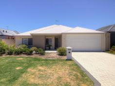 11 Arnside Bend Waikiki WA 6169 $400,000's QUALITY LIVING IN HARRINGTON WATERS! This well cared for property located in the heart of Harrington Waters would be hard to beat for any family looking for a large home in the area. A short walk to the picturesque lake and local primary school, this property is also conveniently located close to public transport and the Waikiki Village Shopping Centre. Upon entering the home, a long hallway runs through the centre of the home with a spacious theatre room on the right and a separate wing encompassing the minor bedrooms and large activity area to the left. Two of the minor bedrooms offer a double built in robe, while the third boasts a walk-in robe. The activity area sits between the bedrooms and could easily accommodate multiple desks to be utilised as a study or as a play area for young children. Progressing further into the open plan living space you will be impressed with the high ceilings and large kitchen that overlooks this central family area. The kitchen is well appointed with 900mm appliances including a five-burner gas cooktop, electric oven, stainless steel range hood and stone benches with soft close drawers as well as overhead cupboards for additional storage. Hidden from view of the main living area is a large fridge recess and huge walk in pantry, both great for keeping supplies for largest of gatherings. The beautiful master suite is located at the rear of the property and has a lovely outlook over the rear landscaped gardens. This bedroom also features a large walk in robe and a good size ensuite with oversize shower recess and closed off WC. To the rear of the property, the large paved alfresco overlooks the reticulated and landscaped gardens. The garden's central feature is a fig tree that provides shade as well as fruit offering a peaceful area to enjoy this garden all year round. Other features include: - 2013 built, Summit - 196m2 of living space with the 263m2 of total house area - reverse cycle ducted air-conditioning - quality timber laminate floors throughout - high ceilings - roller shutters This property has been well maintained by the original owners and is ready for the next family to enjoy this great home in a superb location. Contact David Parlor on 0412 734 727 to secure your private viewing today.