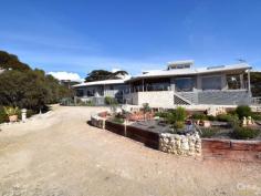5 Jarsean Ct Kingscote SA 5223 $695,000 to $720,000 Contemporary Residence Capturing Natures Best! From first glimpse you will be instantly charmed and pleasantly taken by the individuality of this architecturally designed home nestled amongst native trees where your total privacy is assured. Capturing remarkable ocean and bush land views across the full living canvas toward the 'Bay of Shoals', thoughtful design has ensured the expansive north facing floor to ceiling windows frame the ever changing view, almost like a 'moving picture'. Light filled, the home offers 4 bedrooms, 2 bathrooms (en-suite to master) with the living and entertaining spaces capturing the panorama from every point. The spacious, open plan living incorporates a designer kitchen with granite benches and stainless appliances. High ceilings and timber floors compliment the setting and create a wonderful ambience throughout. Stop and listen to the sounds of native birds or spend tranquil moments interacting with wildlife who share your passion for the freedom the location provides. Externally the hand crafted creativity of planned landscaping, incorporates feature stone & paved garden sitting area, wildlife protected vegetable garden, numerous water tanks, garden shedding and lock up 6m x 12m garage. There is also a garage under main roof and free standing carport.Garden areas are planted primarily with natives and secure with subtle fencing to prevent over zealous wildlife getting too close for comfort! Simply a commanding position that has now become a clever combination of functionality and warmth into a private sanctuary. Full appreciation for this property can only be achieved by personal viewing. For more information contact local selling agent Michael Barrett on 0427 727 333.