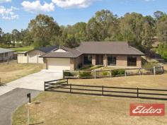 9 Turpentine Dr Cedar Vale QLD 4285 $479,000 Country Charm with this Family Home This is a lovely family home, the 9’ceilings give this home a spacious and airy feeling, and there is plenty of room for the family to spread out. In true “Coral Home” style there is two living areas: the formal lounge with detailed cut out walls and the second one is the fully tiled open plan kitchen, dining and family room (comes with air-conditioner), this room is adjacent to the outdoor entertainment area which will make family functions a pleasure. The main bedroom is large and comes with a walk-through robe and ensuite and its located away from the other 3 bedrooms – all 3 bedrooms come with built in robes and ceiling fans. The home comes with a double integral garage and the added bonus is another big shed (11m x 6m) with power and a small shed on the side, there is also the cost saving 5Kva Solar power system. The backyard is very private and comes with a unique Rustic Theme Gazebo, chicken pen and plenty of room for a vege patch, this section of the backyard is fully fenced but there is more land beyond so if you are ever wanting a pony or a couple of sheep there is plenty of room for another paddock. The Rustic Theme has been repeated at the front of the home with an outback fence and dry creek bed with deck, it’s been beautifully done and is a striking feature of this lovely home. Set on a 1 acre block and located in the great Cedar Vale lifestyle estate, this home is just waiting for you, there is school bus pick up in the area too. Property Details Elders Property ID: 10680104 4 bedrooms 2 bathrooms 4 car parks Land Area 4141 square metres 4 car garage