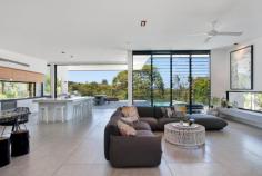 7 Elanda St Sunshine Beach QLD 4567 $3.2M Architectural Masterpiece When architect Tim Ditchfield designed this majestic residence sitting high on the sand dunes above Duke Street, he created a flowing space that took advantage of not just it's highly fancied NE aspect, but its tree top views across to the Pacific Ocean. Sitting on an impressive parcel of land, approximately 50% larger than traditional Sunshine Beach blocks, this architectural masterpiece, offers the perfect balance of contemporary design and beach luxe. At approx. 670sqm, the residence was built using a pallet of contemporary building materials, yet softened with beautiful timber accents and architectural lines drawn from Californian architecture of the 50s and 60s. With a focus on bringing the outdoors in, the heart of the home is both an impressive indoor space and idyllic outdoor escape. The substantial Corian breakfast bar is both minimalistic and warm whilst matches perfectly with the Italian stone bench tops under which Italian appliances fit without fanfare. Flowing outdoor behind 3meter high sliding doors that hide as well as hang off the side of the home, the outdoor kitchen is home to a commercial teppanyaki grill, top of the line Electrolux BBQ and gas burner as well as an industrial double glass door bar fridge. The timber deck has aged beautifully to further soften this delightful space, yet is complimented by almost invisible frameless glass. The pool is both a key feature at night as well as a great day time tree top experience as you look over Sunshine Beach and onto The Pacific. With flexibility a key factor in the design, the home will meet the needs of those looking for either a 3, 4 or 5 bedroom home. The top level of the property is breathtaking, with open plan kitchen, butlers pantry and living area as well as both outdoor and indoor dining options. This level also features a study nook with 3 separate workspaces and a powder room. The lower level features the bedrooms as well as a huge rumpus room, substantial home-office, laundry, I.T room and an under-pool wine cellar and storage area. The entrance with its 3 meter high bright green pivot door and indoor outdoor fish pond, also has an oversized double garage as well as separate pool room/gym/man land. Whilst every room in the house is air-conditioned as well as heated, the current owner has never used the air conditioner in the main living area (due the beautiful summer sea breezes) and typically enjoys the open fire when the breezes turn westerly in the winter months. Elanda Street is a quiet street with impressive homes and is ideally situated just a short stroll from the shops, restaurants and bars of the Sunshine Beach Village, as well as the hugely popular Surf Club and patrolled beach. With the magnificent Noosa National Park and its multitude of walks as well as coves and beaches close by and Noosa Junction and Noosa Heads just over the hill, the location is simply perfect. If you are looking for the ultimate family home that oozes style as well as practicality or a luxe low maintenance beach house then 7 Elanda Street is the perfect solution. PROPERTY DETAILS Offers over $3.2M ID: 395194