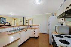 9933 New England Hwy Cabarlah QLD 4352 $485,000 LIFESTYLE PROPERTY - 2 ACRES OF PURE BLISS Are you looking for a picture perfect 2 acres of privacy within a stones throw of Toowoomba and Highfields? Look no further as your dream property is presented. The single owner Gordon Bourke home has been fastidiously maintained and feels like it was only built yesterday. Whilst not brand new, those who appreciate a true quality build will inspect this home and know it was built by builders when quality of work was paramount. Well positioned on the block well away from the road it offers privacy from the street and the rear neighbour, clever planting and positioning again allows you to enjoy the home without a neighbour in sight. With an amazing floorplan that soaks in natural lights and vistas of the treed allotment and covered car accommodation for up to eight vehicles, this is lifestyle buying at its very best. Picture yourself in summer enjoying a meal in the North East facing generous outdoor alfresco whilst watching your family play under the shady tree lined rear yard or on cozy weekend in Toowoomba's winters soaking in the warmth of the wood heater. Ticking all the boxes for what lifestyle should be; it is an absolute must inspect. A credit to the single owners of this property, there really isn't a dollar to spend - the fencing is all in good condition, the oversized shed is near new, there are two water tanks, there is even firewood on the block ready to stoke the heater. Just pack up your current home and move straight in. There is room of course to add some value down the track by modernising the home and any savvy buyer will surely see what is on offer here is amazing buying. Built by owner occupiers FOR owner occupiers, the generous bedrooms, wide hallways and just a solid layout will make this an enjoyable home to own. Property Features: Open plan living and dining with North East aspect Central kitchen with generous storage Second family living room complete with wood heater 40m2 covered North East facing alfresco area Generous master with ensuite and full of storage 3 further bedrooms - 2 generous, the 3rd still a great size and all with built-in storage Full sized laundry with direct yard access Double car garage Double car carport attached to the home Detached 6m x 7m shed with over height 3.2m doors 2nd timber double car carport Security screens throughout Solid construction with cypress and hardwood frames 8098m2 fully fenced allotment RealWay Property Partners is proud to present to the market 9933 New England Highway. Call Cooper Watson today to arrange your exclusive viewing or join us at the next open home. Property Dates and Times Inspection Times 18 February 11:00 AM - 11:30 AM 19 February 11:00 AM - 11:30 AM Property Features Water Rates : $265 Council Rates : $868 Land Size : 8094 m2