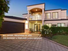 19 Deverall Square Hillarys WA 6025 $1,100,000 - $1,200,000 ALL OFFERS PRESENTED AT 4PM ON MONDAY 6 FEBRUARY (unless sold prior) Grand two storey family home set in an elevated and peaceful Hillarys location and sought after cul de sac nestled amongst other quality homes. With its spacious and luxurious living plus a stunning resort style Alfresco and pool area, this beautiful home is sure to impress! Ideally located with almost everything you need very close by including an easy walk to Whitfords shopping centre and St. Mark's Anglican School (without even needing to cross a road) also in close proximity to public transport, parks and magnificent beaches. - Double front doors lead to tiled entrance extending through to the main living area - Study is conveniently accessed from the foyer and has views into the tranquil front yard - Formal dining or lounge (the choice is yours) off the foyer - The heart of the home comprises of a light and spacious open plan kitchen, family room and meals opening out to the Alfresco for the ideal indoor outdoor lifestyle - Games/theatre room is located off the main living area through double French doors and has an internal window making it easy to keep an eye on the kids! - Family dinners and entertaining will be a breeze in the crisp and modern white chef's kitchen with large bench space, modern European appliances, double pantry and heaps of cupboards - Three double bedrooms downstairs all with built in robes - Family bathroom with dual access to the largest of the three downstairs bedrooms, ideal for guests or a lucky teenager - Large laundry with fitted cupboards - Upstairs parents retreat includes a lounge with access to a generous private covered balcony offering sensational sunsets and views of the Indian ocean, Rottnest and the Rottnest lighthouse in the evenings. Impressive master bedroom with a large fitted walk-in robe, attractive well-appointed ensuite with double basins and shower as well as a free-standing tub. - The timber decked Alfresco and Bali hut overlook the sparkling pool - Easy-care reticulated lawn and gardens - Awesome cubby house for children to enjoy which includes a DVD -TV and play area underneath. - Double automatic garage with direct access into the house and backyard, additional workshop/storage area plus fold away stairs into the roof space Additional features: - Bright white Plantation shutters throughout giving it a Hamptons feel - Ducted reverse cycle a/c downstairs plus split units in all the bedrooms and upstairs lounge - 10 Solar panels - Ample storage including roof area with floorboards for extra storage - Linen press - Recently painted and fully renovated with many of the fittings still under warranty With its combination of grandeur and practicality, situated in the heart of one of Perth's best coastal suburbs, this is a home not to be missed!