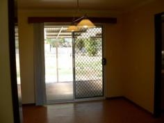 43 Rogers Ave Katanning WA 6317 $179,000 Great Starter House - Property ID: 911505 This 3 x 1 brick and tile home is located in a quiet residential area and within walking distance of two schools, a daycare, the local swimming pool and the town centre. It is has three bedrooms which have all been recently painted and two have new carpet. The hall that leads to the bathroom has also been recently painted and has new vinyl flooring and two separate linen closets. The bathroom is close to the bedrooms and has a separate bath and shower. There is new tiling on the walls and around the bath. The toilet is located next door. The HWS is instantaneous gas. The laundry is large with a tiled floor and a s/steel trough. There is room to add built in cupboards for more storage if needed. The lounge is carpeted and has a rev cycle air con. The owners have patched walls etc ready to paint in this area and the dining room. The dining room is off the kitchen and has vinyl flooring and sliding glass doors out to the back patio. The kitchen is small but functional and has an electric stove and a good sized pantry. To the rear of the home is a patio that covers the back of the house and has a large lockable storage room at one end. There is also a garden shed at the rear of the home. The back yard is spacious with limited garden but plenty of room to create one if desired. The property is fully fenced with fencing separating the front from the back. At the front of the home is a large grassed area and a single car port. This home is solidly built and has some renovations done to modernise the interior and just needs a little more work done to bring it up to date. With a realistic price it is certainly worth viewing. Features Land Size Approx. - 1142 m2 Close to Schools Close to Shops Close to Transport Formal Lounge