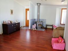 5 Pearse Street Singleton NSW 2330 $375,000 Jerrys Plains - 1.49 Acre Lifestyle Property This neatly presented 3 bedroom home is situated on approximately 6069 sqm (1.49 acres set over 3 titles) and features: * Floating timber floors, combustion fireplace, reverse cycle air conditioner. * Separate lounge & dining areas, laminate kitchen with good sized pantry. * Built in robes & ceiling fans to all bedrooms. * 9m x 5m covered deck, 3 bay lockable shed, fully fenced paddock. * Town water, 5000 gallon water tank, well with pump. This property has a lovely outlook and is located approximately 25 minutes from Singleton & Muswellbrook