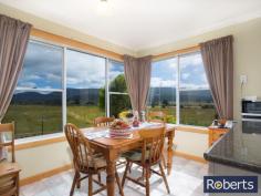 10 Junction Rd Mole Creek TAS 7304 $349,000-$369,000 A MUST SELL A tidier small-holding would be hard to find. This smart three bedroom brick home sits proudly surrounded by over eight hectares of the most gorgeous country anywhere. The mountain scenery is magnificent, enveloping this gentle valley setting. Bordering the eastern boundary of this level property is a trout creek reserve with a pristine limestone stream meandering through farmland toward Mole Creek and, ultimately, the Mersey River. Inside you will find an open plan modern kitchen with picture-perfect Mount Roland views and integrating the dining and lounge areas, three bedrooms (two with built-ins), bathroom, separate W/C, plus laundry. So many extras accompany this rural offering including 16 solar panels, 12mx7m lockable Colorbond double garage with workshop, 4-bay machinery shed, garden and wood sheds as well as chook run. A small mixed orchard graces one side of the circular driveway. Water is abundant and includes rainwater tanks as well as an inexpensive communal creek water system for gardens and toilet. Very good fencing surround paddocks, lending them to animals, cropping, orchard, or small fruit production. Only 80km to Cradle Mountain National Park and conveniently serviced by the nearby Mole Creek township for fuel, PO, groceries and more, this perfect lifestyle property is located less than an hour from Launceston. General Features Property Type: House Bedrooms: 3 Bathrooms: 1 Land Size: 7.97 Hectares