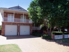 50 Queen St Singleton NSW 2330 $670,000 One of Town's Most Desirable Homes! Belgravia is certainly one of our favourite Master Built properties to hit the market with many outstanding features. * Magnificent entry with stunning parquetry flooring, open fire and cathedral ceiling in formal living room. * Parquetry flooring continues through to study and dining room on the 1st floor. * Spacious timber kitchen with granite benchtops. * Dining and family rooms have sliding doors to verandah which overlooks the tranquil backyard. * Upstairs features 4 bedrooms with new carpet and built in robes 3 of these have balconies. * Master suite features a walk in robe, marble ensuite with spa. * Ample storage available. * New ducted a/c, ducted vacuum and back to base alarm system. * Downstairs features a family / rumpus room with a bar, third shower & toilet & access to the backyard. * Double garage with storage area under the house. * Quality family home that needs to be viewed to enjoy all it has to offer.