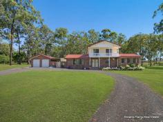 165 Hubner Rd, Park Ridge QLD 4125 Situated on a 1.06 hectare fully fenced block in the prestigious suburb of Park Ridge, this spacious home provides the perfect acreage lifestyle. Offering all the space, privacy and comforts of acreage life along with the convenience of town water and being only minutes to local primary and high schools and the shopping precinct Park Ridge Town Centre. At the front of the home is a porch area where you can sit and enjoy the peace and quiet of acreage living. As you step into the tiled entrance you are greeted by the large carpeted lounge room to the left with bay window, adjoining this room is a carpeted formal dining area that has security screen door access to the fantastic outdoor covered entertaining area with built in sink. To the right of the entrance area is a carpeted bedroom with 2 single wardrobes. As you walk through the entrance there is a good-sized tiled family room with ceiling fan and glass sliding door access to the rear yard. At the heart of it all is the large tiled kitchen with a near new upright electric oven, rangehood, dishwasher and large fridge space. The kitchen also includes a single door pantry and a double door pantry, and an abundance of cupboard and bench space. There is also a storage area underneath the stairs. Also, featured downstairs is an internal laundry with security screen door access to the backyard, adjoining the laundry is a bathroom. At the end of the hallway is a large carpeted bedroom or multi-purpose room with fireplace and wardrobe. This room includes security screen door access to the front porch and glass sliding door access to the backyard. Upstairs you will find 3 carpeted built in bedrooms with ceiling fans. One of these bedrooms includes air conditioning and 2 of these bedrooms have glass sliding door access to the balcony that overlooks the front yard. These bedrooms are serviced by the family bathroom with double vanity and separate toilet. Other features of the home include security screens throughout, double linen cupboard, full pressure town water, water tank, solar power and a 6 x 10 metre garage with 2 roller doors. Take advantage of the opportunity to enjoy the peace and tranquility of this picturesque acreage setting. The zoning for this property is emerging community. Don’t delay, call to arrange an inspection today! The local area has well-established infrastructure, is set to experience future residential growth, and is flourishing with energy, enthusiasm and diversity. Situated within a short distance to Park Ridge Town Centre, the park and ride bus terminal into Brisbane and major retail and commercial precincts. The Logan and Gateway Motorways provide easy access to the Brisbane Airport (30 minutes), Sunshine Coast (60 minutes) and the Gold Coast (40 minutes).