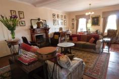 24 Grey St, York WA 6302 Faversham House is considered one of the most beautiful properties in Western Australia and is one of Australia’s oldest privately owned country homes. The residence sits at the end of a gated drive and is set on 1.7 hectares of spectacular heritage parkland gardens and vineyards overlooking Mt Brown. Established by the Monger family in 1840 the property has a fascinating history which includes being gifted to the Australian Government to assist with the war effort in 1941. The house was then used by the Red Cross as a hospital until the 1950’s. The earliest parts of Faversham House date from 1840, and early renovations include a spacious drawing room with fireplace and a sizeable dining hall. It has been in the hands of the current owners since 2004 and boasts interiors restored with Georgian and Victorian features. The gardens have undergone considerable landscaping and feature additions such as the “secret garden and amphitheatre”. With its elegant romantic setting this impressive heritage mansion currently operates as a country house wedding venue, as well as a unique location for corporate functions, which the current owners say generate “good income”. It has hosted over 150 weddings during the past 10 years, as well as many conferences and company meetings for national corporations, government departments and universities, many of which are repeat bookings. 14 bedrooms all with air conditioning, 7 of which are located on the top floor and are extremely spacious accommodating both a kingsize bed and sitting area. Six further bedrooms are set around a pretty courtyard with pergola adjacent to the main building. Two of these have been superbly upgraded in recent years. – Spacious front balcony with fabulous views. – Impressive grounds covering over 5 acres, including established gardens, mature trees, fruit trees and expansive lawns. – Peace and tranquillity whilst still being within walking distance of town. – Listed with the National Trust and registered on the National Estate of the Australian Heritage Commission. – Permission for private residence, private with income or commercial (function centre, B&B, art gallery, restaurant etc). The house is perfect as an idyllic private residence, however the unique setting is ideal for private functions such as company seminars, boutique accommodation or a wedding venue. Situated in the heart of York with an easy walk to the nearby historic attractions and restaurants in town. 75 minutes drive from Perth.
