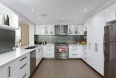80 Veale St, Ashmont NSW 2650 - This home is sure to impress the minute you walk in the door - Tastefully renovated throughout - Not a cent has been spared - Featuring five double sized bedrooms with built-in robes and ceiling fans - Master bedroom with walk-in robe and stunning renovated ensuite - Separate children's retreat upstairs ensures enjoyment for the whole family - Main bathroom has been beautifully renovated plus a third toilet downstairs - Formal lounge/dining, theatre room and large separate rumpus room - Amazing kitchen with marble bench tops, generous breakfast bar, stainless steel appliances and plenty of storage. - Large outdoor undercover entertainment area with spa and sauna - Large double garage, an additional 2 bay shed - Perfect for the Tradesman - Garden shed plus high double carport which is ideal for boats and caravans - Other features include, security system, ducted heating and cooling - Immaculately presented - The friends and family will not be disappointed *All information contained herein is gathered from sources we believe to be reliable, however, we cannot guarantee its accuracy and interested persons should rely on their own enquiries.