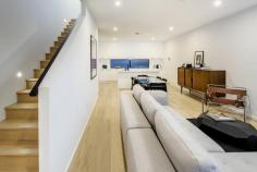 20 Queen Street Adelaide SA 5000 Stunning near new torrens titled townhouse ideally positioned only minutes from the Central market & Hutt Street. Offers by 5pm Tuesday 20th June 2017 unless sold prior With contemporary design philosophy at heart this three level townhouse is sure to please. Be impressed at first glance by the custom oversized front door which leads into the open plan double garage/ study or 4th bedroom that overlooks a rear courtyard. Leading upstairs via the custom oak staircase you enter the main living space which comprises of a modern kitchen and living room which opens onto a fully enclosed balcony ideal for entertaining. The flow of oak flooring throughout this level again adjoins the second staircase taking you to the third level comprising of three bedrooms (main with ensuite) and main bathroom. Features of the property include: -Ducted air conditioning throughout (zoned and dual controls on level one and two) -Alarm system and voice controlled video intercom allowing unlock access -Custom oak staircase and custom black steel hand railing -Oak flooring to second level, fully tiled garage on ground level, carpeted third level -Generous kitchen with stone benchtops, ample storage, stainless steel appliances (electric oven and gas cooktop,) and dishwasher -Floor to ceiling tiles to main bathroom and ensuite -LED lighting throughout including LED lighting to both flights of stairs -Third bathroom / laundry located on ground level. -Possibility of converting part of garage into fourth bedroom or home office (with laundry/bathroom to service) -Double garage -Custom sun blind to balcony area which becomes fully enclosed This townhouse offers an enviable lifestyle in the perfect city location. Lock and leave and extremely low maintenance, simply move in and enjoy luxury living. Council rates: $2,142.45 pa ES Levy: $151.25 pa Year Built: 2017 Specifications 3 Beds 3 Baths 2 Car Spaces