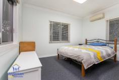 119 Blackwood Rd, Deagon QLD 4017 DELIGHTFULLY MAINTAINED CHARACTER COTTAGE IN A CONVENIENT, CENTRAL LOCATION Sitting comfortably on a wide 784m2 block this comfortable character cottage is just a short walk to transport and the popular Redcliffe to Mitchelton bikeway, and only minutes to schools, cafes and the waterfront – not to mention a direct line of 16km or 20 minutes to the Brisbane CBD. The front veranda invites you to step into this warm, welcoming home. The traditional character of the home with high ceilings, horse hair cornices and quality window treatments is complemented by a contemporary neutral colour scheme. The lounge is serviced by the kitchen and dining area, which leads out onto the expansive fully fenced back yard. it’s a great place to unwind with a BBQ and beers on Friday afternoons as the sun sets. Featuring two bedrooms with a study which could easily be converted to a third bedrooms, the home is comfortable and homey inside with delightful window treatments, but it is the size of the land and the convenient location that sets this property apart. There is potential here to further renovate or expand the existing home, build a granny flat or simply acquire the property as a rental investment and watch it steadily grow in value over time. This an opportunity that will appeal to buyers and developers who can see the potential in the location and generous size and wide dimensions of this block. Central Sandgate is on your doorstep here with schools, train station, parks, lagoon, bars and clubs all within fifteen minutes’ walk, this location offers an unmatched combination of walk-to convenience and relaxed family living in a convenient, urban pocket of Deagon. If you’ve been searching for an affordable, well maintained character home that also offers space and convenience, or a solid rental return, this property will exceed your expectations. For your own private inspection, please call the office now. This opportunity will not last long! Open 7 days Phone 07 3203 6001 (24 Hours)