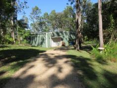 LOT 24 MOUNTNEY ROAD Strathdickie Qld 4800 BEAUTIFULLY LANDSCAPED ACREAGE WITH HUGE SHED & WEEKENDERPRIVACY AND BEAUTY This beautifully landscaped 6.5 acre property has a huge shed with an adjoining weekender overlooking beautiful gardens and neighbours dam. As you walk among the manicured lawns you are taken back to a place of peace and tranquility.The property is 3/4 fenced with tank and bore water and is slightly undulating. Come and inspect this property and you will fall in love with it with its privacy and beauty. Strathdickie is a short drive to Airlie Beach and Cannonvale with all major shopping, doctors, marinas, pools, beaches. The Gateway to The Great Barrier Reef Call the agent now for your private inspection