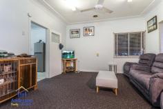119 Blackwood Rd, Deagon QLD 4017 DELIGHTFULLY MAINTAINED CHARACTER COTTAGE IN A CONVENIENT, CENTRAL LOCATION Sitting comfortably on a wide 784m2 block this comfortable character cottage is just a short walk to transport and the popular Redcliffe to Mitchelton bikeway, and only minutes to schools, cafes and the waterfront – not to mention a direct line of 16km or 20 minutes to the Brisbane CBD. The front veranda invites you to step into this warm, welcoming home. The traditional character of the home with high ceilings, horse hair cornices and quality window treatments is complemented by a contemporary neutral colour scheme. The lounge is serviced by the kitchen and dining area, which leads out onto the expansive fully fenced back yard. it’s a great place to unwind with a BBQ and beers on Friday afternoons as the sun sets. Featuring two bedrooms with a study which could easily be converted to a third bedrooms, the home is comfortable and homey inside with delightful window treatments, but it is the size of the land and the convenient location that sets this property apart. There is potential here to further renovate or expand the existing home, build a granny flat or simply acquire the property as a rental investment and watch it steadily grow in value over time. This an opportunity that will appeal to buyers and developers who can see the potential in the location and generous size and wide dimensions of this block. Central Sandgate is on your doorstep here with schools, train station, parks, lagoon, bars and clubs all within fifteen minutes’ walk, this location offers an unmatched combination of walk-to convenience and relaxed family living in a convenient, urban pocket of Deagon. If you’ve been searching for an affordable, well maintained character home that also offers space and convenience, or a solid rental return, this property will exceed your expectations. For your own private inspection, please call the office now. This opportunity will not last long! Open 7 days Phone 07 3203 6001 (24 Hours)