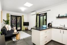 27 Manningham St, Parkville VIC 3052 Parkville prestige combines with the contemporary style of a two year old renovation to deliver this two bedroom, two bathroom city fringe abode, sure to delight investors, downsizers and those seeking an entry point into an exclusive market. Modern in design, the kitchen boasts extra wide soft-closing drawers, induction cooktop and glass/stainless steel canopy rangehood. A clever foldaway breakfast table opens up the living domain when not in use. French and glass sliding doors from the living zone and master bedroom respectively, proceed to a tranquil, easy care entertaining courtyard, basking in northerly light. A 1:1 ratio of bedrooms to bathrooms ensures the master enjoys an exclusive ensuite whilst the second bedroom accesses a spacious central bathroom incorporating laundry function with floating vanity and open shower common to both. Add to that screened property boundaries to enhance privacy within a serene, eucalypt lined plantation streetscape, surveillance cameras for peace of mind, sky lights to brighten a splendid interior and split system air conditioning for continuous comfort and the result is city fringe chic. Superbly placed metres to Royal Park, Flemington Road trams, Flemington Bridge Station and CityLink with Melbourne's university and hospital precincts, CBD and Melbourne Zoo just minutes away.