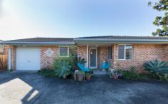 1/10A Pitt Street Coffs Harbour NSW 2450 Opposite a family friendly park and local tennis courts; this low maintenance villa in a complex of just two is perfectly positioned within walking distance to the heart of the CBD! Brick and tile in construction; the tiled foyer provides entry into the open plan home. The galley style kitchen offers electric appliances including an upright stove plus there is internal access to the SLUG. The carpeted living/dining offers reverse cycle air conditioning and a ceiling fan. Adjoining is the north facing, fully fenced courtyard; ideal for alfresco dining. In the eastern wing of the home you will find two carpeted bedrooms both with mirrored built in robes plus the main bedroom offers a ceiling fan. Located directly between the two rooms is the bathroom and separate toilet for convenience. Additional features include: NBN connected, solar power, 250L solar hot water and inclusive laundry in garage. This centrally located property is ideal the home for the first homebuyer, a sound asset for the Investor or the best low maintenance property for the retiree to enjoy.