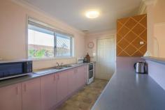 1/10A Pitt Street Coffs Harbour NSW 2450 Opposite a family friendly park and local tennis courts; this low maintenance villa in a complex of just two is perfectly positioned within walking distance to the heart of the CBD! Brick and tile in construction; the tiled foyer provides entry into the open plan home. The galley style kitchen offers electric appliances including an upright stove plus there is internal access to the SLUG. The carpeted living/dining offers reverse cycle air conditioning and a ceiling fan. Adjoining is the north facing, fully fenced courtyard; ideal for alfresco dining. In the eastern wing of the home you will find two carpeted bedrooms both with mirrored built in robes plus the main bedroom offers a ceiling fan. Located directly between the two rooms is the bathroom and separate toilet for convenience. Additional features include: NBN connected, solar power, 250L solar hot water and inclusive laundry in garage. This centrally located property is ideal the home for the first homebuyer, a sound asset for the Investor or the best low maintenance property for the retiree to enjoy.