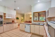 30 Parakeet Pl, Howard Springs NT 0835 THE FEATURES Sizeable family 4-5 bedroom, 2-3 bathroom home on 5 acres of tropical bliss Gated front driveway provides formal entrance Bitumised driveway is high and dry year round Tropical gardens screen the home for ultimate privacy Gorgeous home has roll front verandah Carport parking for 2 plus a built-in dog lock up Verandah spans front of home and wraps around back of home Gorgeous in ground swimming pool with rockery feature Home has enormous living room with separate dining room Central kitchen has breakfast bar plus pantry 3 bedrooms plus study at the front of the home Large master suite enjoys ensuite and walk in robe Main bathroom includes a relaxing bath tub Huge shed has built in office / FULLY SELF CONTAINED FLAT with additional bathroom 2 registered bores and town water Established tropical gardens and rolling green lawns around home Property located 5 minutes from Howard Springs shops Easy access to the Ichthys accommodations 5 minutes from the popular Howard Springs Park 10 minutes from Palmerston CBD THE BENEFITS Located in a quiet area in this supremely popular estate, this established family home has lush tropical gardens and sprawling lawn areas surrounding a home that requires naught – simply move in and enjoy it as much as the current owners do. The home is extremely well looked after by proud owners who tend to its every need. Inside is an expansive open living room with tiled flooring, glass fronted French Doors that open onto the verandahs that wrap around 3 sides of the home offering bountiful entertaining space under its shaded roof. Back inside, the home has a central kitchen with two-way access to both the dining and living rooms. The kitchen also includes a large pantry, great storage and prep space, a dishwasher plus a breakfast bar as well as quality appliances throughout. The home offers 4 bedrooms that each have A/C and a built-in robe along with large windows that frame the tropical greenery from outside. The master also enjoys a walk-in robe and en-suite amenities plus there is a study or small 5th bedroom option as well. Endless hours will be spent splashing in this tropical oasis with a large in ground swimming pool nestled at the base of tall palms. The area has a large paved portion where you can entertain under the stars or sunbake while the kids splash about. Also on the property is an enormous workshop shed with a built-in office or granny flat and bathroom amenities, additional verandah area plus RWT and a side parking bay as well. Located a short 5 minute drive from the popular Howard Springs Park and the shops, the home is also under 10 minutes from Palmerston CBD making it the ultimate rural retreat without compromising on your everyday necessities. THIS PROPERTY HAS BEEN PRICED BY A BANK VALUATION TO PROVIDE ACCURATE AND COMPETITIVE VALUE TO YOU THE BUYER. Book your private inspection today.