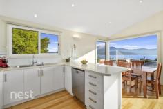 2/37 Kaoota Road, Rose Bay, TAS 7015 Cleverly positioned to enjoy all of the views that Hobart is famous for this beautiful 3-4 bedroom and 2 bath strata developed home is just what you've been looking for. Energy efficient in design and boasting a large living area and 2 private sundecks you will be instantaneously whisked away to your happy place upon entry. Parking is plentiful with 2 spaces off street and a secure single garage with internal access. Through this internal access you rise to the main level of the home that has glorious polished hardwood flooring and accommodates the main bedroom and living, kitchen and dining area. The social area of the home has abundant sunlight and the open plan nature allows generous floor space to accommodate a joyful family life. The kitchen is well appointed with modern European appliances and is positioned to enjoy ever-changing views of Mt Wellington, The River Derwent and the nearby Lindisfarne Foreshore. The main bedroom is huge and has a substantially sized walk in robe and lovely ensuite. All bedrooms have been appointed with hardwearing wool carpets and allow sunlight to enter at different moments of the day. On the lower level there are queen sized bedrooms both with built in wardrobes and both with their own private access to the secure back yard and under deck patio. The main bathroom on this level has bath, shower, vanity and toilet and a third separate toilet can also be found on the ground floor. A smaller 4th bedroom or study is a bonus thus providing a great space to be utilised for many things. Finishing off this level is the internal laundry, two linen cupboards and under house storage. This home is warm, inviting and comfortable. It is situated within easy 5 minute commute to the CBD and provides and aspect and vista that most people can only dream on. Built to accommodate family living it is as equally suited to a retiree or investor and we welcome your enquiry to allow inspection for your own opinion. , NBN connected , Induction cooktop , Double Glazed Windows and Doors , Private Position , Daikin heat pump , Foam Cladding enhancing the energy efficient nature of design