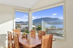 2/37 Kaoota Road, Rose Bay, TAS 7015 Cleverly positioned to enjoy all of the views that Hobart is famous for this beautiful 3-4 bedroom and 2 bath strata developed home is just what you've been looking for. Energy efficient in design and boasting a large living area and 2 private sundecks you will be instantaneously whisked away to your happy place upon entry. Parking is plentiful with 2 spaces off street and a secure single garage with internal access. Through this internal access you rise to the main level of the home that has glorious polished hardwood flooring and accommodates the main bedroom and living, kitchen and dining area. The social area of the home has abundant sunlight and the open plan nature allows generous floor space to accommodate a joyful family life. The kitchen is well appointed with modern European appliances and is positioned to enjoy ever-changing views of Mt Wellington, The River Derwent and the nearby Lindisfarne Foreshore. The main bedroom is huge and has a substantially sized walk in robe and lovely ensuite. All bedrooms have been appointed with hardwearing wool carpets and allow sunlight to enter at different moments of the day. On the lower level there are queen sized bedrooms both with built in wardrobes and both with their own private access to the secure back yard and under deck patio. The main bathroom on this level has bath, shower, vanity and toilet and a third separate toilet can also be found on the ground floor. A smaller 4th bedroom or study is a bonus thus providing a great space to be utilised for many things. Finishing off this level is the internal laundry, two linen cupboards and under house storage. This home is warm, inviting and comfortable. It is situated within easy 5 minute commute to the CBD and provides and aspect and vista that most people can only dream on. Built to accommodate family living it is as equally suited to a retiree or investor and we welcome your enquiry to allow inspection for your own opinion. , NBN connected , Induction cooktop , Double Glazed Windows and Doors , Private Position , Daikin heat pump , Foam Cladding enhancing the energy efficient nature of design