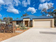 7 Skewes Way, Bedfordale WA 6112 These are the four ingredients that will make this the best value and most sort after home in the Churchmans Brook Estate. DON’T TAKE MY WORD FOR IT SEE FOR YOURSELF! This fabulous four bedroom two bathroom plus study home, built in 2010, is situated on a lovely unspoiled low maintenance 4137m2 bush block, with city views and an internal living areaq of 239m2. If you include the garage, alfresco and porch it equates to 341m2 WOW!!! Upon arrival you’ll notice the lovely native gardens and rockery to the left of the property and to the right the well positioned 7m x 6m workshop with 2.7m height clearance to park 4 wheel drives etc. The home itself has an inviting double door wide entry, with the master bedroom and shoppers entry accessed from here. The master suite has separate his and her walk in robes and a large ensuite with separate wc and luxurious double shower. The hub of the home is the fantastic chef’s kitchen with double door pantry, dishwasher, an abundance of bench/cupboard space and breakfast bar. This overlooks the huge open plan family living and dining area, with the large double door home theatre nestled in the corner. The outlook to the block is fabulous with views from the many windows that allow natural sunlight in and access to the alfresco entertaining is through quality by-folding doors. All the guest bedrooms are located down the left hand side of the property, all have built in robes and are serviced by a spacious bathroom with separate bath and shower. The study/activity room and laundry are also located here. Other features of this home include ducted reverse cycle air-conditioning for all year round comfort, gas bayonet if needed, solar hot water, tiled floors throughout the living areas, walk in linen cupboard, NBN connected, 31c ceilings and huge alfresco entertaining area that integrates with the main living area via the by-fold doors. Last, but not least, there is a well designed private courtyard which makes a fabulous parents retreat, with a small grassed area and timber decking. Add a hot tub, music and a bottle of wine, then you can forget the worries of the day. Call now for a private viewing or look out for the home open this weekend! Features Air Conditioning Built In Robes Courtyard Dishwasher Ducted Cooling Ducted Heating Fully Fenced Outdoor Entertaining Remote Garage Reverse Cycle Aircon Secure Parking Solar Hot Water Study Workshop