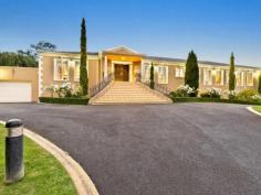 1 Harcourt Pl, Lower Plenty VIC 3093 Masterfully designed, lavishly appointed and beautifully executed, this refined family estate set amongst 6001m2 (approx) of manicured gardens offers the perfect blend of indoor and outdoor spaces that showcase a resolute commitment to luxury, prestige and craftsmanship for a truly enviable lifestyle. Palatial proportions, contemporary elegance and luxurious finishes throughout and will captivate from the onset. The grand reception foyer branches out to three distinct precincts. To the right a magnificent old world office with mahogany finishes and an additional study/library occupy the front of the home. A wide hallway leads down to premier chef's kitchen intelligently designed to incorporate quality European appliances, sublime Caesar stone bench tops, an abundance of storage and an outlook over the adjacent spacious meals and family room offering picturesque garden vistas and seamless transition to exquisite outdoor entertaining zones. The centre of the reception foyer opens to the formal lounge and adjoining dining room exuding timeless elegance befitting the most regal of events. While the west wing of the home is dedicated to five lavish bedrooms which are serviced three deluxe bathrooms all portraying the keen attention to detail and luxurious finishes the rest of the residence prescribes. At the end of this wing a vast rumpus room with built-in bar transitions out to a superior indoor solar heated swimming pool and large spa. Adding to this home's vast appeal is a fully equipped gym, flood lit tennis court with gazebo, fabulous alfresco entertaining precincts, verdant gardens, 8 car garage and all the modern conveniences that deliver unlimited luxury. This exclusive Lower Plenty address is one of Melbourne's hidden secrets and denotes the pinnacle of elite family living. Inspections by appointment only. Ducted heating Refrigerated cooling Security Alarm Pristine kitchen with premium European appliances 3 spacious living areas 2 dining areas Unprecedented outdoor entertaining spaces 5 sumptuous bedrooms 3 luxurious bathrooms Indoor/in ground solar heated pool Fully equipped gym Floodlit tennis court with gazebo 8 car garage Lavish details throughout Exclusive address