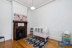 147 Wellington St, Flemington VIC 3031 Traditional character, complete comfort and a sunny courtyard backdrop lead the long list of attractions associated with this enticing Victorian terrace. The polished floors and high period ceiling of a classical entrance hall introduce two double bedrooms, each enhanced by original fire-places. A central living/dining area catches northern natural light and features its own polished floors, period fire-place and a Rinnai gas heater. Light filled renovated bathroom with laundry facilities. To the rear, a bright separate kitchen is beautifully presented and opens to a rear courtyard complemented by the natural advantage of north westerly aspects. Rear right-of-way provides the option to introduce off street parking if so desired. Mt Alexander Road trams, Flemington shops and the CBD all within conveniently easy reach.