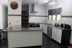 10 Zill Rd, Girraween NT 0836 $759,000 negotiable Two hectares (5 acres) fully fenced selectively cleared with lush gardens and manicured lawns fully reticulated and serviced by a 7 litre per second water bore. Coded 5 bedroom, 3 bathroom elevated home is neat as a pin, freshly painted internally. 2 Living areas with 4 bedrooms and 2 bathrooms upstairs and spacious 1 bedroom self contained granny flat with bathroom downstairs with attached 8m x 12m screened entertainment area.. Huge main bedroom with en-suite. Modern kitchen with granite bench tops, lots of cupboards and walk in pantry. Full length verandahs front and rear overlooking the nice gardens and pool area. Coded 14m x 6m full concreted carport. Splash out in the 90,000 litre in ground concrete swimming pool, pebble creted and with lavish sandstone finishes, large shade sail. Fully coded 16m x 17m masonry block walled shed / workshop (272 SQM) concrete floor area with high ceiling space and has 3 phase power. Ideal location for family with children, walking distance to Girraween Primary School and three minute drive to Coolalinga shopping hub and twenty minute drive to Darwin City.