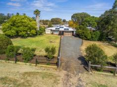 2 Fiona Street, Kingsthorpe, QLD 4400 $365,000 Kick back & relax in your new home that has everything for the whole family. With room to move on 4287m2 of land, away from the hustle & bustle of city living only minutes from town. This immaculate family home features fresh new paint throughout and holds a practical and comfortable floor plan that with suit all family members. Air conditioned lounge room with ceiling fans in all rooms & cosy wood heating to accommodate all weather conditions. Functional and practical kitchen has electric cook top & wall oven, dishwasher, with the added bonus of fresh rain water plumbed to sink. Four bedrooms with three bedrooms having built ins & ceiling fans with a functional and convenient two way bathroom off the main- just perfect! With Summer just around the corner it's a perfect time to cool off & relax with family & friends in the fully private above ground solar heated pool with timber decking, sensational rustic style gazebo with built in bar, great for all entertaining occasions. Additional covered outdoor area off the house adds to the functionality of the home. The fully fenced house yard is great for the kids and family pets and is surrounded by easy care gardens will take the stress out of everyday living. Dads will love the 9x7.5m & a 7x7m fully powered sheds, with loads of power points & lighting plus even more room in the single double carport off the house. 20 solar panels with a huge 5kw inverter takes care of rising power bills, and over 70,000lts of rain water plumbed to the house takes care of water bills. Fruit trees, chicken coop and garden shed make this family home a nothing more to do or spend. This great family home has it all! You won't find better, if you do buy it!! FEATURES: Air Conditioning Built-In Wardrobes Ceiling Fans Close To Schools Close To Shops Close To Transport Fireplace(S)