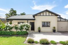 18 Creslin Terrace, Camden Park SA 5038 $595,000 When the essence of 1920’s charm meets a modern renovation in a popular location close to Glenelg, Immanuel College and overlooking the green belt of the Westside Bikeway – you’ve struck family gold. Stemming from its rose-scented gardens and rendered façade, undeniable bungalow beauty takes hold – leadlight entry and wood floors underfoot to darting eyes over decorative fireplaces and sky-high ceilings – it’s magic. This home has a lot to say about style and entertaining with versatility of up to four bedrooms (or two living rooms) and a landscaped, north-facing garden oasis. Relaxed informal space for TV and winding down, or an adjoining area equally at home as a fourth bedroom or formal dining? Go with what your family craves right now. As plantation shutters and downlighting add irresistible complement to character, the shiny galley kitchen upgrade does too. Stainless freestanding oven and splashbacks add sheen to the crisp finished décor, and French doors to your adjoining casual dining let more of that north-facing light in. Cue events here if the rear garden is any indication–it’s impressive. This gabled, all-weather entertainer is swathed in paving with lawns edged by soldiering palms. And when there’s room for play, dining and lounging afterwards, you’re winning. With a bathroom that nails looks, modern flair and functionality you keep winning. The exquisite suite of powder white with a punch of neutral tones (and bubbling spa) says fine style indeed. At day’s end, it’s all you need as you happily collapse in either of the generous front bedrooms–be it the master with robes and decorative fireplace, bedroom two across the hall with wall-length robes, or the sunny third enjoying rear garden views. There’s a lot to love locally; Glenelg needing no introduction, Cross Road and Anzac Highway as your shopping, city, or coastal gateways for fun in the sun. Creslin Terrace has all the family credentials. Highlights: C.1920 Renovated Bungalow retaining classic features Manicured 561sqm (approx.) allotment facing a reserve Up to 4 bedrooms North-facing rear alfresco entertaining Renovated bathroom with spa Ducted evaporative air conditioning Ducted gas heating 3 R/C split systems Renovated kitchen with freestanding, stainless steel oven Working fire place in the lounge room Security system Double length drive-through garaging Large rear shed for 2 cars (or workshop) Minutes to Immanuel College Ride the Westside Bikeway to Glenelg