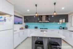 15 Bilin Bilin St, Bonner ACT 2914 A spectacular four-bedroom family home perched on a generous 630 m2 block on the elevated upper north side in the popular suburb of Bonner built with quality, comfort and most importantly space in mind is calling on families looking for a quality large family home with the best view in greater Gungahlin. If you want to live close to nature yet enjoy all the luxuries of modern living, this north facing home overlooking a nature reserve will be sure to amaze. The orientation of the house ensures energy efficiency and abundance of sunlight throughout the day. This immaculately presented split level home takes full advantage of the elevated position with a separate formal lounge room and a huge family and open plan kitchen that walks onto the large tiled balcony with amazing views across north Canberra and beyond. The kitchen is sure to amaze the gourmet chef with its storage, functionality and quality appliances. The main bedroom boasts a large walk-in robe with en-suite and all other bedrooms are very generously sized with built-in robes and with beautiful views. Bathrooms are appointed with quality floor to ceiling tiles and a three-way main bathroom featuring a spa bath, double vanity, semi-frameless shower screens and complemented by a separate powder room. Bonner is becoming the suburb of choice for buyers in Gungahlin due to established facilities, schools, shops, public transport as well as close proximity to the new Amaroo shops and Gungahlin Town Centre. Features Include: - Main bedroom with walk-in robe and en-suite - Additional spacious bedrooms all with mirrored built-in robes - Ceiling fans in all the bedrooms - Abundance of storage options - Two separate living areas - Fully rendered front - Gourmet kitchen with 40 mm thick island stone benchtop, soft close drawers and built-in pantry - Appliances: 900 mm gas cooktop, range hood, oven and dishwasher - Reverse cycle heating and cooling with two separate zones - Tiled deck with gas and water connection - Complete landscaping both at the front and rear of the house - Double lock up garage with internal access - Ducted vacuum - Laundry with external access - Covered outside entertaining area with concrete flooring - NBN Connected - Security camera installed Home information: - Year Built: 2014 - Rates: $2,078 p.a - Total area: 257.55 m2 (approx..) - Ground floor: 105.2m2 - Upper Floor: 83.6m2 - Garage: 36m2 - Deck: 30m2 - Porch: 2.75m2 - EER: 5