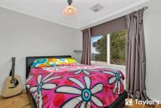 5 Usk Ct, Para Hills SA 5096 $359,000 This neat and tidy family home boasts breath taking views and ticks all the boxes. Comfortable, convenient, secure and affordable! The home features 3 bedrooms, two living areas, dual street access, large backyard and is situated on the elevated corner of a quiet could- de- sac, perfect for a family or those who love to entertain. The 3 bedrooms all have timber floors, the master bedroom features a large walk in robe and bedroom 3 is set up as a nursery. The home has twin living areas with a L-shaped lounge/ dining room and large rumpus room adjacent the kitchen, complete with servery and direct backyard access through the twin sliding doors. A Panasonic ducted reverse cycle air conditioner sets the climate for year-round comfort. The kitchen has a pantry and dishwasher, whilst cooking is taken care off by the stainless steel gas stove. The bathroom has been updated and instantaneous gas hot water has also been fitted. The home has a large well maintained rear yard with plenty of room for the kids and family pets. Twin carports at either end of the home offer secure undercover parking with automatic roller doors. Adjacent to the carport a pattern paved patio area perfect for those warm summer nights and family BBQs. Two generous sized tool sheds stem off the second carport. Whilst the high clearance roller door would make an ideal place to store the caravan or boat. Located on a corner block with 705m2 within walking distance to Montessori early learning child care centre, whilst a short drive to the local schools, shops and sports clubs make this ideally located home a must see.
