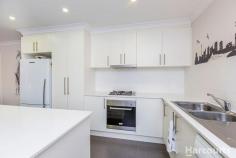 69 Bieundurry St, Bonner ACT 2914 $680,000 + This immaculately presented family home features a flowing floorplan that spreads across 4 bedrooms, 2 living spaces, luxurious interiors and abundance of natural lights throughout. Located in a nice street with quality homes around, this home offers beautiful mountain views from the open plan family and kitchen which features island stone benchtop and quality appliances. The north facing covered entertaining deck is perfect for those who enjoy the option of entertaining both indoor or outdoor all year round. This home boasts 4 spacious bedrooms, segregated master suite with stylish en suite and walk-in robe to give luxury and privacy to parents. Other 3 bedrooms are good sized, all with built in robes. The main bathroom with full height porcelain tiling, semi-frameless shower screens and bath tub is complemented by a separate toilet Bonner is becoming the suburb of choice for buyers in Gungahlin due to established facilities, schools, shops, public transport as well as close proximity to the new Amaroo shops and Gungahlin town centre. Features Include: - Segregated main bedroom with walk-in robe and en suite - Three other good size bedrooms with built-in robes - Two separate livings, formal lounge with privacy blinds - Gourmet kitchen with 20 mm thick island stone benchtop, gas cooktop, oven, dishwasher, soft close drawers and ample storage options - Combination of tiles and carpet flooring - Ducted gas heating and cooling - Neat and Low maintenance landscaping both front and rear with artificial grass - Double locked up garage with internal access - Laundry with 20 mm stone benchtop and external access - Covered outside entertaining area with painted concrete flooring and a separate concrete nook near the backyard fence - Pinewood fencing with retaining wall built with stone - 2000L rainwater tank