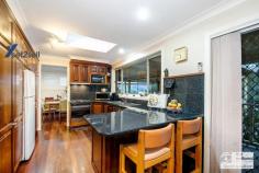 18 Ervine St, Winston Hills NSW 2153 $1,170,000 to $1,230,000 Adorned with an abundance of luxuries to ensure you enjoy a lifestyle of true comfort this handsome highset home boasts the natural warmth of DUCTED UNDER FLOOR GAS HEATING - FULLY DUCTED AIR CONDITIONING - AN ENSUITE TO THE MAIN BEDROOM - Timber Kitchen with dishwasher - auto garage doors . . . EXCELLENT PRESENTATION and so much more. From the moment you arrive the home welcomes you with charm and you smile when you notice the return veranda is bathed in sunshine making it a great spot to enjoy a morning coffee and read the news. Featuring 3 BIG DOUBLE SIZE BEDROOMS, a formal lounge, separate dining room, a family room, Jarrah Floorboards and 2 modern bathrooms there's ample space inside for the young growing family and, of special mention . . . the Double Garage is enormous (would easily hold 4 small cars and has STORAGE GALORE!) Also offering a large covered rear patio for your outdoor entertaining, plenty of yard for the kids and the pets this is ONE OF THE BEST. And YES, this quiet street is very convenient being close to shops, schools, parks and within walking distance of the M2 Express buses. Offers will close at 3pm on 23rd October but BE QUICK as owners WILL SELL beforehand.