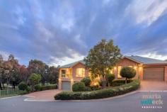 4 Newbu Pl, Ngunnawal ACT 2913 Occupying the prized Tenth Fairway position of the Peninsula Golf Course Estate with uninterrupted views across the tree-lined greens, this monumental builder's own residence offers space, comfort and relaxation. Built to the highest of standards, the brick home offers two-storeys of spaciously allocated living complete with multiple outdoor spaces for unwinding and taking in the stunning golf course views. Flowing from the front foyer, you´ll find the oversized formal lounge and dining rooms, a family and casual dining area set beneath cathedral ceilings and leading to separate outdoor entertaining areas, and at the heart of the home the expansive timber kitchen with top-end appliances and granite benchtops. For those needing extra space for entertaining, hobbies, or a home business, the lower level features a large rumpus and an enormous poolroom that leads to a private covered outdoor entertaining space. Accommodation includes five bedrooms, the double-size master with a walk-in-robe and spa ensuite, a second ensuite, two additional bathrooms, laundry, sauna, a double garage and a single garage. Surrounded by easy-care manicured gardens in one of Ngunnawal´s most enviable and tightly held positions, this exquisite family home won't last long. Feature list: Located in the prized Tenth Fairway of the Peninsula Golf Course Estate Uninterrupted tree-lined views Incredibly spacious to suit even the largest of families Multiple indoor and outdoor entertaining areas Oversized formal lounge and dining rooms Open-plan family and casual dining area with cathedral ceilings Expansive timber kitchen with top-end "Miele" appliances and 40mm granite benchtops Lower rumpus room Huge pool room, perfect for teenagers, hobbies or a home business Five bedrooms Huge master bedroom retreat with a spa ensuite and a walk-in-robe Bedroom two with an ensuite Large bathroom Powder room for guests Large laundry with external access Large concrete verandahs Lower bathroom with sauna Ducted reverse-cycle heating and cooling throughout home, zoned Security system Ducted vacuum throughout Two hot water systems, 'Rinnai', with four separate temperature controls Extra large double garage, with three-metre openings Additional single garage, with a three-metre opening 'Buggy' garage on the lower level with separate remote access to golf course Easy-care manicured gardens Terraced vegetable gardens Enviable and tranquil location