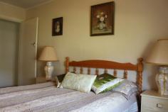 14 Link St, Bingara NSW 2404 $260,000 Enjoy the comfort of this inviting home, ideally located close to the main street in Bingara. There are lovely views of distant hills and farmland on the quiet end of Link Street. It's always been carefully maintained, and includes all the convenience, cosiness and qualities of country living. For Investment or Lifestyle, this is a beauty well worth inspection. Owner is retiring. FEATURES: 3 bedrooms (main with built-ins and ensuite) Spacious lounge room with tailored curtains, blinds and window awnings, rev. cycle a/c. Kitchen/Dining evap. a/c, simple u-shape design with overhead cupboards, elec. Stove/oven, rainwater to kitchen sink Formal Dining Large hallway storage cupboards Sunroom with more built-in storage, new timber shutters Main bathroom shower, toilet, large vanity Laundry good size, includes elec. Hot water system Front and back patio with non-slip tiles/steps Double lock-up garage with workshop and covered fernery Established garden PLUS: New roof Fully fenced Always well maintained