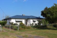 14 Link St, Bingara NSW 2404 $260,000 Enjoy the comfort of this inviting home, ideally located close to the main street in Bingara. There are lovely views of distant hills and farmland on the quiet end of Link Street. It's always been carefully maintained, and includes all the convenience, cosiness and qualities of country living. For Investment or Lifestyle, this is a beauty well worth inspection. Owner is retiring. FEATURES: 3 bedrooms (main with built-ins and ensuite) Spacious lounge room with tailored curtains, blinds and window awnings, rev. cycle a/c. Kitchen/Dining evap. a/c, simple u-shape design with overhead cupboards, elec. Stove/oven, rainwater to kitchen sink Formal Dining Large hallway storage cupboards Sunroom with more built-in storage, new timber shutters Main bathroom shower, toilet, large vanity Laundry good size, includes elec. Hot water system Front and back patio with non-slip tiles/steps Double lock-up garage with workshop and covered fernery Established garden PLUS: New roof Fully fenced Always well maintained