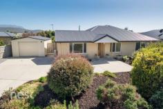 11 Bonsai Pl, Margate TAS 7054 $515,000+ With excellent schools, shops, boat ramp and recreation areas, it's no wonder that Margate is a highly sought-after area in the channel. Having so many lifestyle conveniences within walking distance means this four bedroom, two bathroom family home on a sizeable, level block of 730m2 is sure to attract a lot of attention. Privacy is something that is of great consideration when purchasing in suburbia and the professionally designed and landscaped nature of this garden affords the owner just that. Be it from the inside looking out or from the level rear yard and entertaining space. Bonsai Place is also a no through road and being situated near the end it is a peaceful position that many different types of buyers will thrive in. This home is large in proportion and its only upon entry that you truly understand this. The flexibility of the floorplan provides two separate living areas allowing separation if you can't decide what you wish to view on the Television. The main living area is part of the large open plan kitchen and dining area that is spacious and eye catching with a large kitchen as the centrepiece. This room has hard wearing Tas oak flooring throughout and is a great space for entertaining guests also. The PVC double glazed windows and doors open to the private entertaining areas that combine undercover and open elements. The kitchen itself is beautifully appointed and styled with an amazing amount of storage, full length island bench, dual wall oven, 5 burner Gas Cooktop and dishwasher. All bedrooms are grand in size, with good sized built in wardrobes and the master benefitted by ensuite and walk in robe. In fact the amazing amount of storage found in this home is more substantial than most homes I have seen. The bathroom hasn't been forgotten and if it's a busy family that needs to be accommodated then the size of this bathroom will easily do this. The space within this important area of the home easily accommodates separate bath, large shower, vanity and toilet. The home is energy efficient in nature being fully insulated and double glazed but is also well heated throughout with each bedroom afforded a wall mounted panel heater and the living area having the best of both worlds with a centrally positioned wood heater and also a wall mounted split cycle heat pump and air conditioning unit. This one won't last long so call me to arrange an inspection before you are too late.