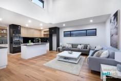 20 Hogg Street Casey ACT 2913 Why build your new dream home when it's already waiting for you in the serene suburb of Casey. Set on a large 694m2 block adjacent to a nature reserve, and with easy access to Gungahlin and Horse Park Drive, this spacious and incredibly beautiful home has only just been meticulously completed. You'll be captivated by its striking exteriors through to its sumptuous open-plan interiors, flowing through multiple living areas drenched in natural light and framed by cathedral ceilings. With 280m2 of living, the home offers a grand foyer, formal lounge and dining, casual dining and family room, stunning oak kitchen with induction cooking, integrated appliances and a butler's pantry, and an upstairs rumpus with impressive views all the way to Black Mountain Tower. Outside you'll enjoy year-round entertaining with an undercover alfresco area, speciality fire pit with inbuilt seating, and an upstairs balcony for taking in the views. Accommodation includes five large bedrooms, all with built-in-robes, master bedroom upstairs with a huge walk-in-robe and gorgeous ensuite, two additional bathrooms, laundry, large double garage, and lots of storage space. Other features include Blackbutt floating floors, recessed lighting, and a stunning reclaimed timber staircase. This wonderful family home should not be missed. Brand new luxury home - only just completed 280m2 of sun-drenched living Cathedral ceilings Quiet location next to nature reserve Five large bedrooms, all with built-in-robes Master bedroom on upper floor with a walk-in-robe and ensuite Separate fifth bedroom, perfect for an office or guest bedroom Two additional stunning bathrooms Formal lounge and dining Spacious open-plan dining and family areas Chef's kitchen with butler's pantry, 'Caesarstone' benches, AEG integrated appliances and induction cooking Upstairs rumpus perfect as a parents' retreat Large undercover outdoor entertaining area Custom firepit area for year-round entertaining Easy-care landscaped gardens Double garage with additional storage 2 Mitsubishi electric reverse cycle airconditioning Quality internal fittings Floating Blackbutt timber floor with a contemporary matt finish Reclaimed Blackbutt timber staircase Laundry chute 2 x 2000L rainwater tanks 400L solar hot water Easy access to Gungahlin and Horse Park Drive Ideal for the discerning family who enjoys relaxation, lavish living and year-round entertaining