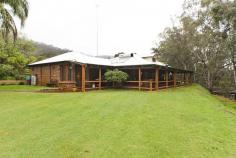 1212 Chittering Road Lower Chittering WA 6084 When a double frontage river is a constant companion, overlooked by a modern home, designed to utilise the treed river views from every room, then a very private paradise has been created. Add to this a workshop of large dimensions – fit for a vintage car buff, a 5,000 GPH bore and a golf practice range and you have the ultimate lifestyle! Fewster and Stone designed and built the craftsman executive residence with the river outlook feature to afford open plan living in the unrivaled privacy. The additional office and music room, off the master bedroom, provides family living for the 3 bed, 2 bathroom layout. Evaporative air conditioning from two units. Extensive storage in the double car port adds to the space. An artistically laid out garden (including Mulberry and Fig trees) has the benefit of the bore and rain water supply. A private gazebo allows entertaining in the garden to receive a hideaway appeal for the after-five drinks time. An engineer built bridge over the Brockman is constructed for ‘three lifetimes’. The two bores, with one in reserve, allow reticulation to the 150 metre golf range and front paddocks. Bird life a feature, with Blue Wrens in profusion. 200 metres of double sided Brockman River is the focus point of the executive rural estate, with a ‘lock-style’ dam in the river. Cobbler and marron hide in the water way. 25,000 gallon plus 15,000 gallon rainwater storage. 30 Geese call the property home! The workshop is 285 square metres and has a 50cm (20″) floor to support the heaviest workshop demands. 4 side-door access. Benches surround office and spare parts area. The 3 tonne hydraulic 3 phase hoist is a mechanics dream amenity. Adjacent area of a 7 acre title on the south side is also available to purchase to create a total area of 17 acres. CALL JOHN GARLAND TO DISCUSS IN FURTHER DETAIL OR ARRANGE TO INSPECT.