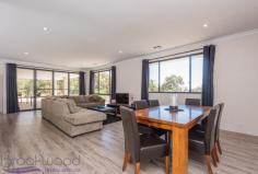 25 Peaceful Ln, Gidgegannup WA 6083 $699,000 Property Details Block Size 5 acres Zoning Rural Res Shire Rates $2,325 Description You can’t help but wonder why you would want to build when you can skip past all the stress and go straight to enjoying your brand new home. Built in 2016, this 4 bedroom 2 bathroom Redink home is superbly spacious with 3 separate living areas and large bedrooms to accommodate a growing family. Nestled on a 5-acre parkland cleared and pasture battle axe block, a fantastic semi-rural lifestyle awaits you in this friendly neighbourhood. 4 bedrooms 2 bathrooms 2016 Redink family home Expansive open plan living Deluxe theatre + activity Huge master w/ WIR + ens Large jnr bedrooms w/ BIR Gently elevated alfresco Parkland cleared + pasture 5-ac battle axe, rural view Friendly community locn Tucked away behind parkland timber, this battle-axe property is set in a rural pocket that is convenient for day-to-day life. A portico extends from the front of the home, welcoming you into the wide entry. The master suite is set to your right, offering sought-after separation from both the junior wing and living hub. The expansive space features a beautiful rural outlook, large walk-in robe and open ensuite. The ensuite is finished with dark décor and suggests sophistication and indulgence with double vanities, a double shower, large bath and separate wc. From the main entry, timber look flooring and high ceilings continue throughout the home, as does ducted reverse cycle air conditioning for optimal comfort all year round. Double doors open into the home theatre that offers itself as your new go-to spot for watching the latest releases. The hallway opens to unveil the spacious open plan living hub in the heart of the home. A long breakfast bar connects the kitchen to the lounge and dining whilst creating a convivial spot for casual meals and chit-chat when entertaining family and friends. Complete with a full suite of stainless steel appliances that include a 5-burner gas cooktop, wall-mounted electric oven, grill and dishwasher, it also boasts a huge walk-in pantry and handy IT recess. Sliding doors continue to the adjoining entertaining alfresco. Gently elevated over the rural vista and pasture beyond, this is a fantastic space for casual BBQ dinners or celebrations with friends and family. Glow in the dark quartz in the exposed aggregate concrete creates an otherworldly atmosphere at night. The junior wing offers fantastic separation for growing families, plus a third living area with a versatile activity space that could be used for kids to play, teens to study or young adults to retreat to. The three junior bedrooms are each a large queen size with mirrored built-in robes, making them rival some modern masters. The 5-acre property is part parkland clear and part pasture and offers itself as a blank canvas for your future vision. With plenty of room for livestock, a big shed or pool, you can establish it however you see fit! Set in the premium location of West Gidgegannup, this fantastic family home is in a friendly semi-rural neighbourhood. It’s an easy drive into the bustling Midland CBD and short commute to the endless delights of the Swan Valley for fun come the weekend. To arrange an inspection of this property or for friendly and honest assistance with any of your real estate needs call Mr Happy – Ross Webster – 0407 387 004.