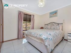 24 The Barracks, Cockatoo Valley SA 5351 $635,000 2.24ac. Very large, well-appointed home, huge outdoor entertaining area and excellent shedding complex. Desired location near Gawler offering quality living options and standards. LAND: 2.24ac. Located on the fringe of the urban sprawl, Cockatoo Valley provides a real sense of country living where there is ample space to enjoy, without the burden and upkeep of larger acreage properties, whilst being only minutes from all the facilities Gawler has to offer. The property itself has an inviting entrance with a remote control electric gate along with all the essential components a holding of this size should have such as fruit trees, a great chook enclosure, room for further development, an abundance of shedding, a good water supply and, of course, a large family home. RESIDENCE: This 1990 built, brick veneer home incorporates 29 squares of living space that includes 6 living zones, up to 5 bedrooms, 2 bathrooms and is embraced by a wide bullnose verandah and a huge undercover entertaining area. The home has a northerly aspect which invites the light in through any of the 6 bay style windows and the central atrium. One of these windows is in the kitchen, where the space is plentiful. With a built-in electric oven and separate grill, gas hot plates and provision for a centre workspace, the kitchen is perfect for a cook of any level. Dine in either the formal dining area, which via a gentle step down connects with the lounge, or the casual meals area which, in turn, flows into the family living section where there is a most appropriate slow combustion heater. With lounge, dining, meals and family areas there is space for all – then we add in the 4.5m x 6m games room and it’s easy to see how numerous the living options are. The study could be utilised as a 5th bedroom, however, it is the master, with its large walk-in robe and full size ensuite bathroom that is most impressive. A unique design feature of the home is the central atrium. Additional benefits and features of this large home include full tiled flooring, ducted evaporative air conditioning, many external roller shutters and a 5kw solar unit for efficient living. Storage is also in abundance with many built-in features plus a storeroom located near the updated laundry and third toilet with basin. Attached to the rear of the home is a wonderful outdoor undercover entertaining section. The Colorbond gable roof structure covers the paving and the stone wall, which incorporates a built-in barbeque. The brick wood shed is very handy and is alongside yet another storage area. IMPROVEMENTS: Anyone for shedding? The main shedding complex begins with a double carport that has an automated panel lift door. Next, is a single garage with automatic roller door. The internal access door leads to the 40’ x 25’ workshop that contains a mass of built-in shelving, has power, concrete floor and a single roller door. Also internally connected is the 33 ‘x 13’ caravan or boat shed. So, whether it’s for a workshop, boats, caravans, trailers, tractors or car enthusiasts, there is purposeful shedding. Water is stored in 6 x tanks that total approximately 30,000 gallon and provides a generous supply of rainwater to the home, which is supported by the mains water supply. Aviaries and other sundry shedding all exist, ensuring this property has so much to offer.